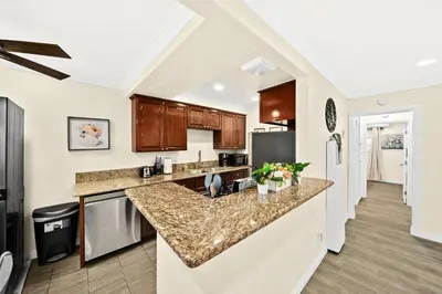 a kitchen with a large counter top in a room at Elegant Exclusive Escape In Downtown Los Angeles in Alhambra