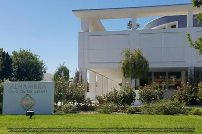 a building with a sign in front of it at Elegant Exclusive Escape In Downtown Los Angeles in Alhambra