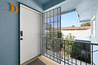 an open door to a balcony with a view at Blissful Utopia near Downtown LA in Alhambra
