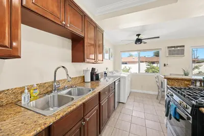 a kitchen with a sink and a stove at Blissful Utopia near Downtown LA in Alhambra