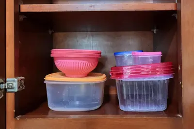 four plastic containers and a bowl on a shelf at Idyllic Paradise Near Downtown Los Angeles in Alhambra