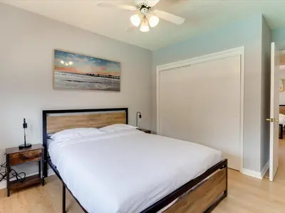 a bedroom with a bed and a ceiling fan at Charming 5 Bedroom Granada Hills House with Pool in Los Angeles
