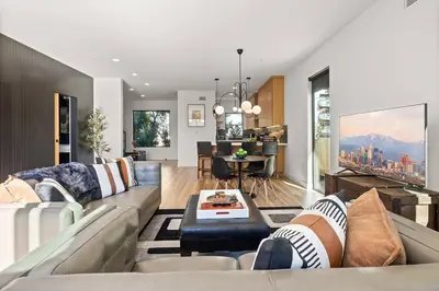 a living room with a couch and a table at Rooftop 3B 3BA House Near Dodger Stadium and DTLA in Los Angeles