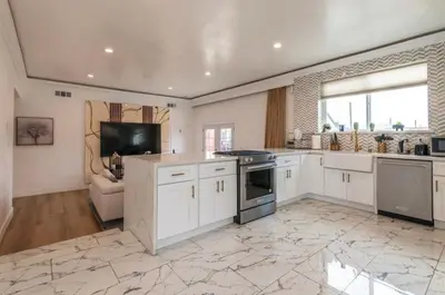 a large kitchen with white cabinets and a stove at Elegant Living Private Room in Modern Home 9 in Los Angeles