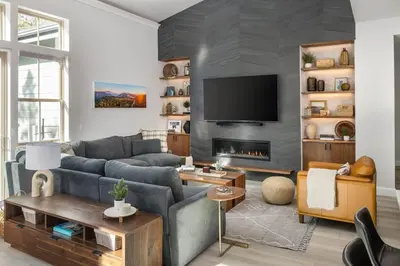 a living room with a couch and a fireplace at Aspen Glen Modern Retreat in Big Bear Lake