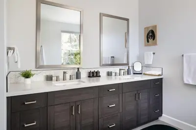 a bathroom with two sinks and two mirrors at Aspen Glen Modern Retreat in Big Bear Lake