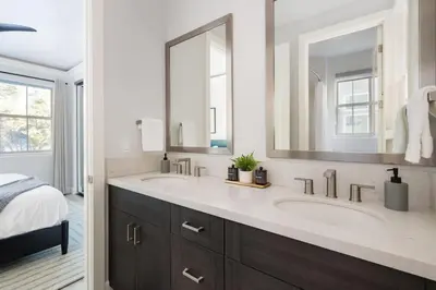 a bathroom with two sinks and a large mirror at Aspen Glen Modern Retreat in Big Bear Lake