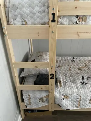 a wooden bunk bed with two bunk beds in a room at LA Love Home in Los Angeles
