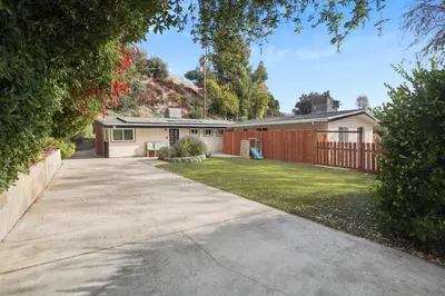 a house with a fence and a driveway at The Perfect Vacation Spot Near Six Flags Magic Mountain in Santa Clarita