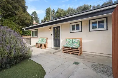 a house with two chairs sitting outside of it at The Perfect Vacation Spot Near Six Flags Magic Mountain in Santa Clarita