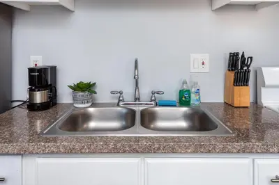 a stainless steel sink in a kitchen at Deluxe Modern 2BR Apt in Prime Location in Los Angeles