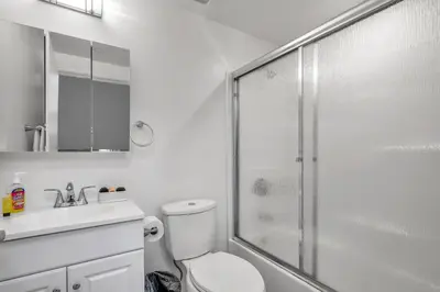 a bathroom with a shower and a toilet and a sink at Chic 2 Bedroom 2 Bathroom 3 Level Loft Style Condo by Hollywood Free Gated Parking Full kitchen in Los Angeles