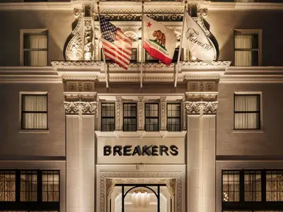 a facade of a building with flags on it at Fairmont Breakers Long Beach in Long Beach