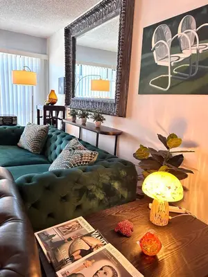 a living room with a couch and a table at Beverly Estates in Los Angeles