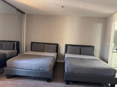 a bedroom with two beds in a room at Loft & Two Bedroom Hollywood apartments FREE Parking in Los Angeles