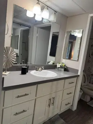 a bathroom with a sink and a large mirror at Loft & Two Bedroom Hollywood apartments FREE Parking in Los Angeles