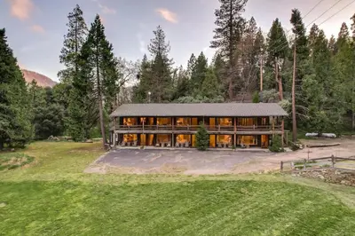 a large house in the middle of a field at Sierra Vista @CN Lodge #8 in Ponderosa