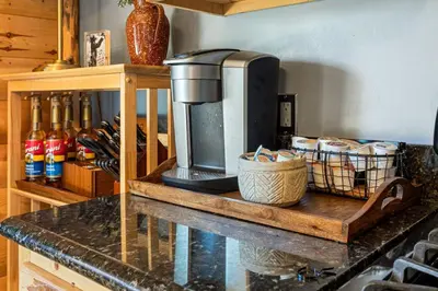 a kitchen counter with a coffee maker on top of it at Little Lakeview Lodge in Big Bear Lake