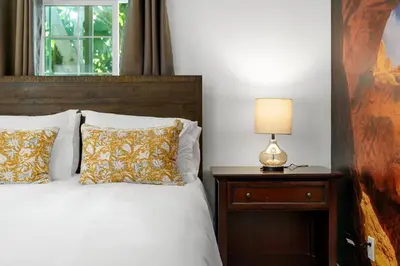 a bedroom with a bed and a lamp on a nightstand at Casa Lanzit - 35 Percent Off All March! in Los Angeles