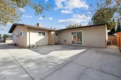 a house with a driveway in front of it at Modern City Ranch 3 bdrm Family Home Access by Dirt Road in Palmdale