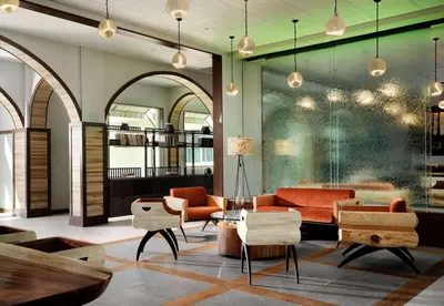 a lobby with a couch and chairs and a table at Sanctity Hotel Rancho Cucamonga, Tapestry Collection Hilton in Rancho Cucamonga