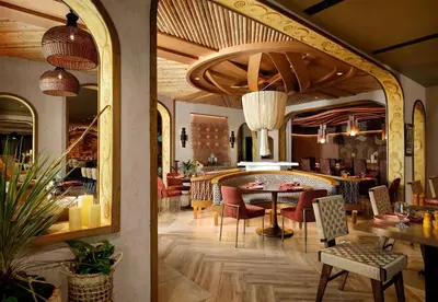 a dining room with a table and chairs at Sanctity Hotel Rancho Cucamonga, Tapestry Collection Hilton in Rancho Cucamonga