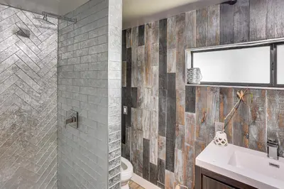 a bathroom with a sink and a shower at Lake Arrowhead Cabin with Hot Tub and Mountain Views! in Lake Arrowhead