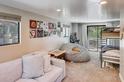 a living room with a couch and a chair at Lake Arrowhead Cabin with Hot Tub and Mountain Views! in Lake Arrowhead