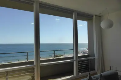a room with a large window with a view of the ocean at OCEAN PARADISE SANTA MONICA ADJACENT 2 Bedroom in Malibu
