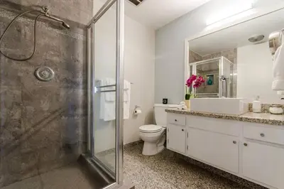 a bathroom with a shower and a toilet and a sink at OCEAN PARADISE SANTA MONICA ADJACENT 2 Bedroom in Malibu