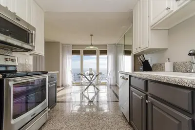 a kitchen with a sink and a stove top oven at SURF-N-SAND 2-Bedrooms, MALIBU in Malibu