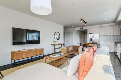 a living room with a couch and a kitchen at Luxurious 2Bed 2Bath Apartment at Formosa in Los Angeles