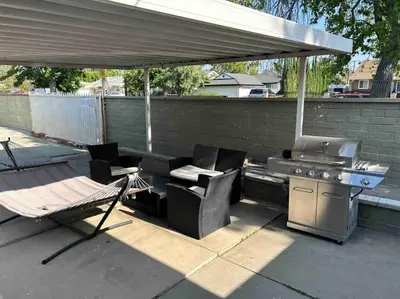 a patio with a barbecue and a grill and chairs at Private Studio GuestHouse With Everything! in Los Angeles