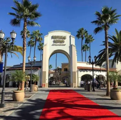 a red carpet in front of a building with palm trees at Private Studio GuestHouse With Everything! in Los Angeles