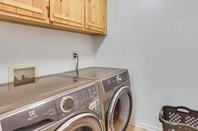 a washer and dryer in a laundry room at Crestline Home with Deck Less Than 2 Mi to Lake Gregory! in Crestline