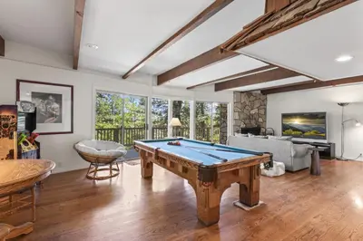 a living room with a pool table in it at Luxe Mountain Retreat Lake Village Close Game Room AC Backs up to trails in Lake Arrowhead
