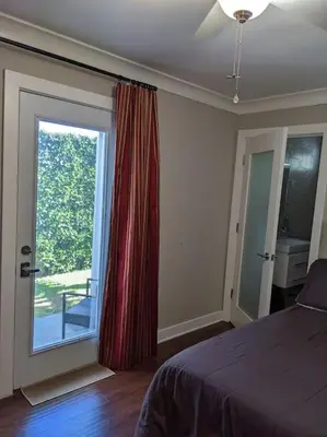 a bedroom with a bed and a large window at Bedroom Suite with Private Entrance in Los Angeles