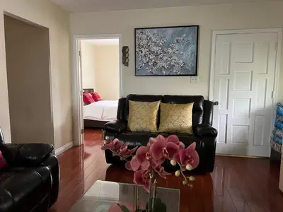a living room with a couch and a bed at Alhambra\u7cbe\u54c1\u5957\u623f\u72ec\u7acb\u536b\u6d74 in Alhambra