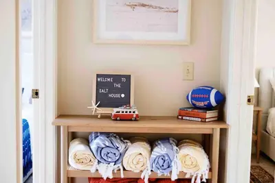 a book shelf with a toy car on it in a room at Cool Cali Vibe - Barefoot Stepping Distance 2 Sand in Oxnard