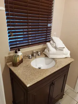 a bathroom sink with towels on top of it at The Treetop Terrace at The Historic Arrowhead Lodge in Twin Peaks