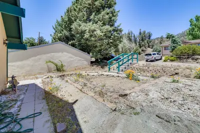 a garden with a ramp and a car in a driveway at Frazier Park Cabin with Ping-Pong Table, Near Trails in Frazier Park