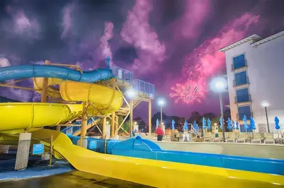 a water slide at a water park with fireworks at Courtyard by Marriott Anaheim Theme Park Entrance in Anaheim