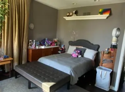a bedroom with a bed and a bench in it at Luxe in Hollywood Hills- modern oasis, pool 5 min to Sunset in Los Angeles