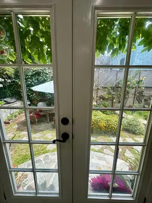 an open door with a view of a garden at Oasis Hollywood in Los Angeles