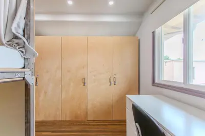 a kitchen with a cupboard and a window at Westholme Park - Female Only in Los Angeles
