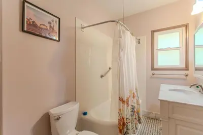 a bathroom with a toilet and a shower and a sink at Westholme Park - Female Only in Los Angeles