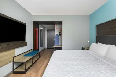 a hotel room with a bed and a flat screen tv at Tru by Hilton Norco Eastvale in Norco