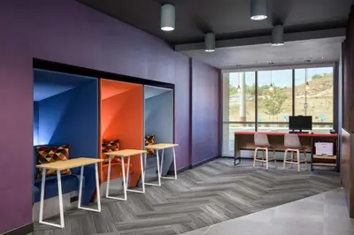 an office with purple walls and a table and chairs at Tru by Hilton Norco Eastvale in Norco