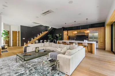 a living room with a couch and a table at The Bella Villa Venice Beach - luxury interior design - spa and terrace in Los Angeles