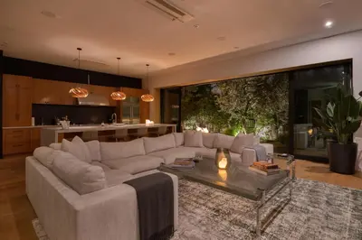 a living room with a couch and a table at The Bella Villa Venice Beach - luxury interior design - spa and terrace in Los Angeles